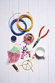 Utensils for making colourful peace sign glitter decorations