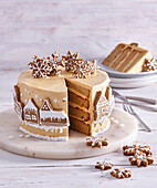 Festive Christmas cake decorated with gingerbread biscuits