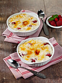 Flambéed rice pudding with raspberries