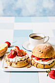 Sweet breakfast sandwiches with mascarpone, strawberries, milk chocolate, and almonds