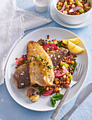 Pan fried trout served with lentil stew