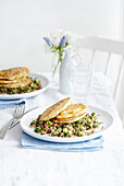 Corn pancakes on grain salad