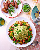 Minced beef skewers and couscous with vegetables