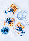 Waffles with powdered sugar and blueberries