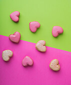 Heart-shaped macarons on a bright colored background