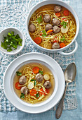 Rich beef broth soup with egg noodles