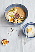 Exotic fruit bowl on banana-mango cream with chia