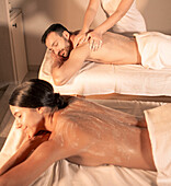 Couple massage at spa with peel procedure