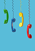 Different coloured telephone receivers, illustration