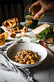 Squash gnocchi with chanterelles and olive oil