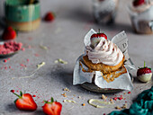 Strawberry cupcake with cream topping