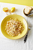 Spaghetti with lemon sauce, chili and parmesan cheese