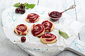 Vegan puff pastry buns filled with cherry coconut jam