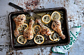 Roasted chicken thighs with lemon slices and capers
