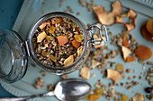 Homemade granola with dried fruit in a jar