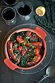 Sausage stew with Puy lentils, black cabbage, and gremolata