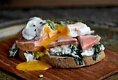 Toast with Earl Grey salmon, a poached egg and spinach ricotta