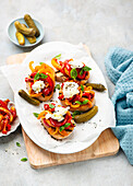 Crostinis with colorful peppers and goat cheese