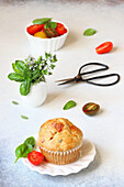 Muffin with scamorza, tomatoes, and olives