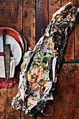 Herbed salmon grilled in newspaper