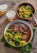 Garlic beef stew with braised kale