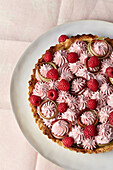 Vegan coconut tart with rhubarb mousse and raspberries