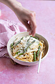 Vegetarian spaghetti carbonara with white and green asparagus