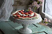 Summer berry pizza on a cake stand