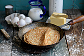 Pancake in a pan next to the Ingredients
