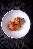 Gulab Jamun (Indian dough balls) with rose syrup and pistachios