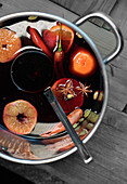Homemade sugar-free mulled wine with chilies and clementine