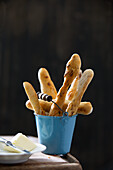 Mini baguettes in a small bucket
