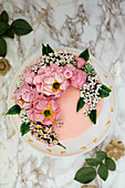 Chocolate and almond buttercream cake with flower decorations