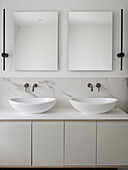 Minimalist bathroom with double sinks