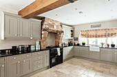 Light colored, country style corner fitted kitchen cabinets