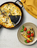 Frittata nera with melted tomatoes