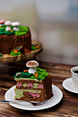 Autumnal pistachio berry cake decorated with meringue mushrooms