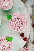 Raspberry cupcakes with pink cream topping