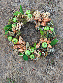 DIY wreath made from dried blossoms and green apples