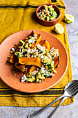 Butternut squash wedges with spicy corn and avocado salsa