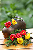 Alpine decoration (cowbell, pine branches, and DIY paper flowers)