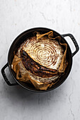 German Sourdough Bauernbrot bread on a marble background