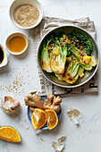 Braised bok choy cabbage with ginger, soy sauce and red orange juice