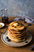Stack of blueberry pancakes with butter