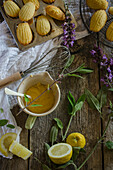 Lemon and sage madeleines on a rustic wooden kitchen table