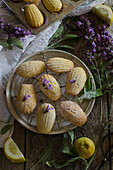 Lemon and sage madeleines on a rustic wooden kitchen table
