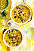 White Bean Tomatillo Roasted Pepper Soup on a yellow cloth