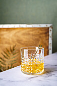 Crystal glass with whiskey served on marble table
