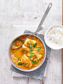 Fish and tomato curry served with rice