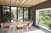 Dining area with closed doors and picture window